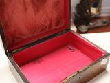 a small open box on a table in a room