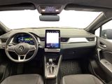 a picture of a car dashboard with a steering wheel and a touch screen