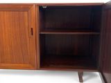 an image of a wooden cabinet with open doors