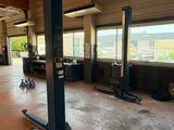 an image of a garage with a lot of work on the floor