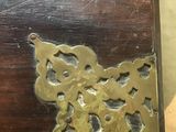 a close up of a wooden table with a clock on it