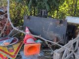 a pile of debris that is sitting on the side of the road