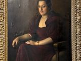 tableau représentant une femme en robe rouge assise sur une chaise