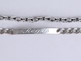 pair of silver plated bracelets with the word fight engraved on them
