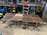 three tables that are sitting in the middle of a room