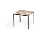 a small table with a tiled top and metal legs