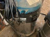 two vacuums that are sitting next to each other on the floor