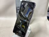 a cell phone that is sitting on top of a stand