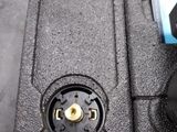 a black box with a black speaker in it