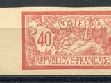 a stamp with a picture of a man laying on the ground