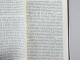 someone is holding a book open to a page with a picture on it