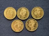 four gold sovereigns of the british royal family on a blue background
