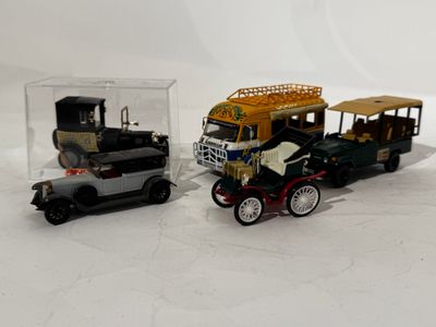 two toy cars that are sitting next to each other