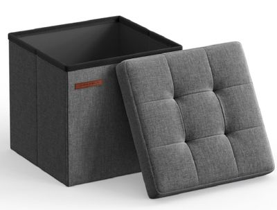 un pouf gris avec un couvercle noir et une assise noire