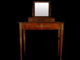a small wooden table with a mirror on top of it