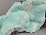 a close up of a piece of rock with a green substance on it