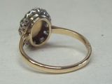an image of a close up of a ring with a stone in it