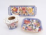 three pieces of chinese pottery including a toilet paper holder and a toilet roll holder