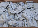 a cardboard box filled with lots of white items