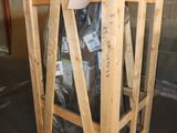 a wooden crate with a bag of garbage inside of it
