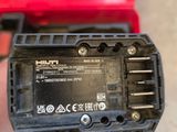 a close up of a person holding a battery in their hand