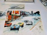 many pictures of cars on a table with pictures of them
