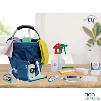 a bag of cleaning supplies on a table next to a potted plant