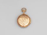an antique gold pocket watch with a chain on a white background