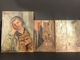 several paintings of women are displayed on a shelf in a room