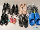 several pairs of shoes are lined up on a table
