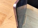 a laptop that is sitting on a wooden table