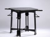 a black table with a black top and a black base