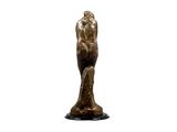 statue of a man holding a bird on a pedestal