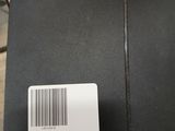 an open black box with a barcode on it sitting on a table