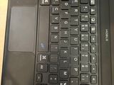a close up of a laptop keyboard on a table