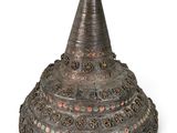 an old metal cone shaped object on a white background