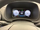 a steering wheel with a digital display in the center of it