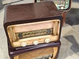 three old fashioned radio ' s stacked on top of each other