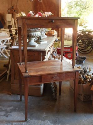 a wooden chair and a table in a room
