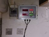 a control panel mounted on the wall of a room