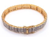 a gold and diamond bracelet on a white background