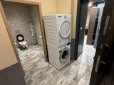 a washer and a dryer in a small room