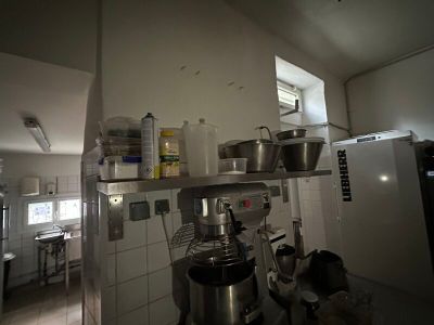 a picture of a kitchen with a lot of pots and pans