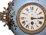 a clock with roman numerals on the face of it