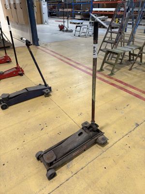 two jack stands on the floor in a warehouse