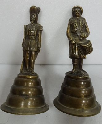 pair of brass figurines of a soldier and a drummer