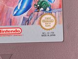 an image of a nintendo game with a blue robot on top of it