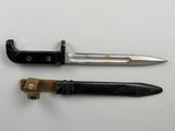 two different types of knives on a white surface