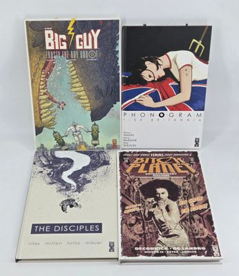 three books are sitting on a white surface with a white background