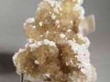 a small piece of crystal on a stand on a table